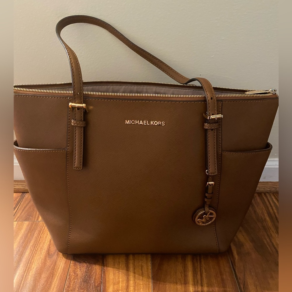 Michael Kors Shoulder Bag in color luggage with gold hardware.